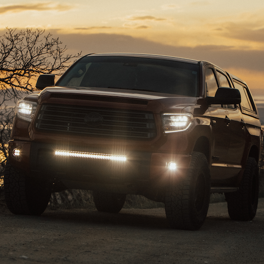 clear behind the grille light bar mounted on a toyota tundra